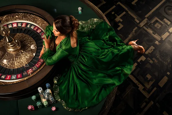 A cheerful woman in traditional clothing using her smartphone during a festive moment, showing how easily the JILIX app fits into everyday life.